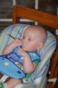 Hank enjoys his first rice cereal at Aunt Laura and Uncle Jon's house